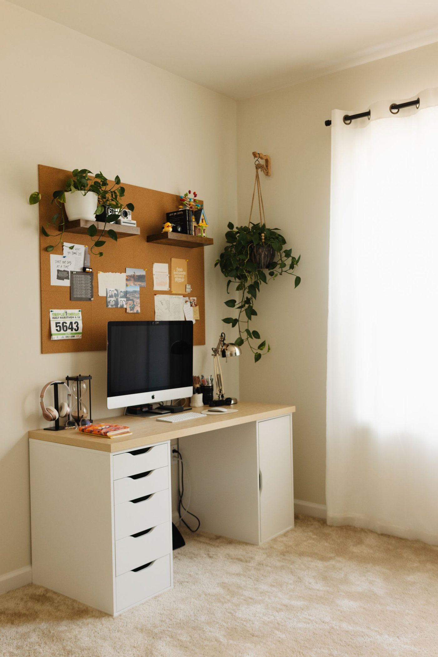 A minimalist home office workspace, calm and organized for a working parent's daily routine.