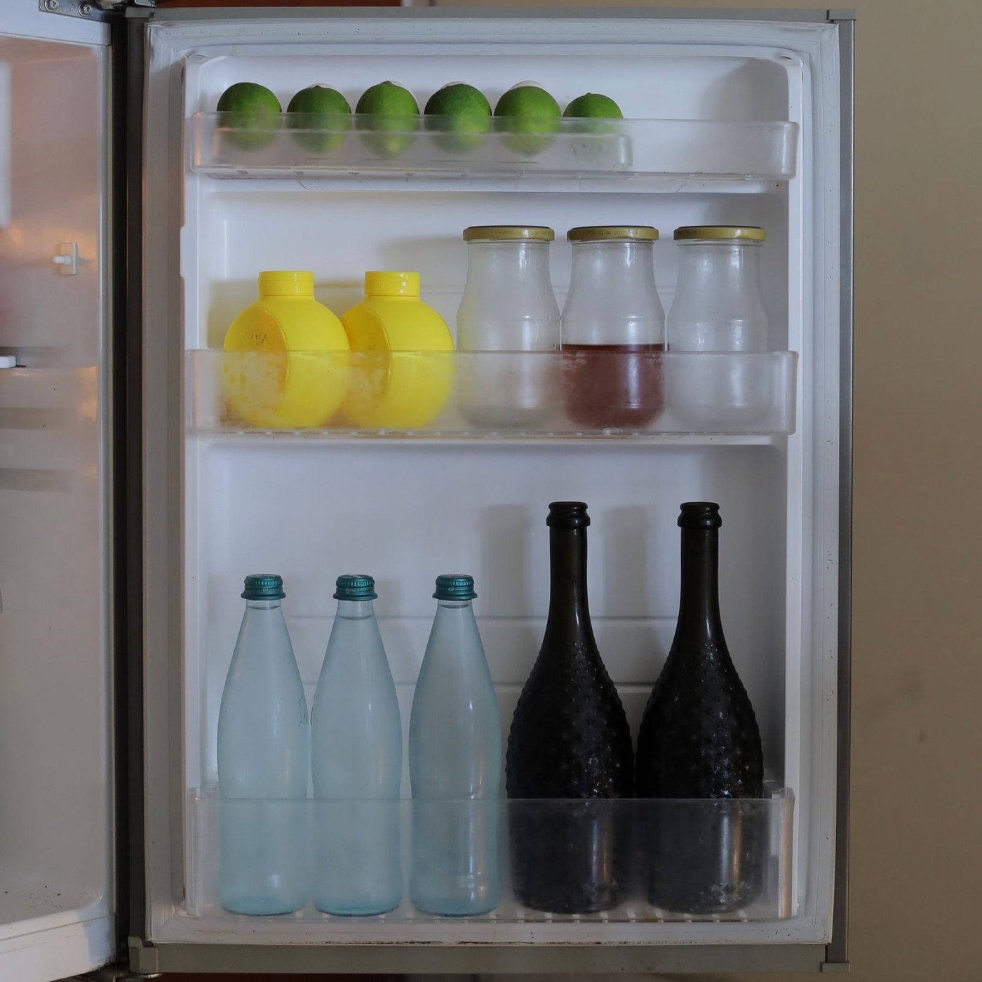 A calm, organized refrigerator door shelf ready for holiday grocery overflow.
